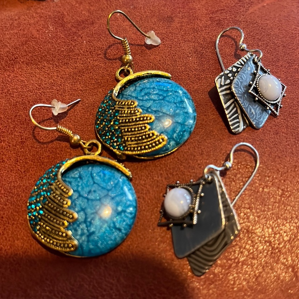 Two pair blue and gold and blue and silver earrings